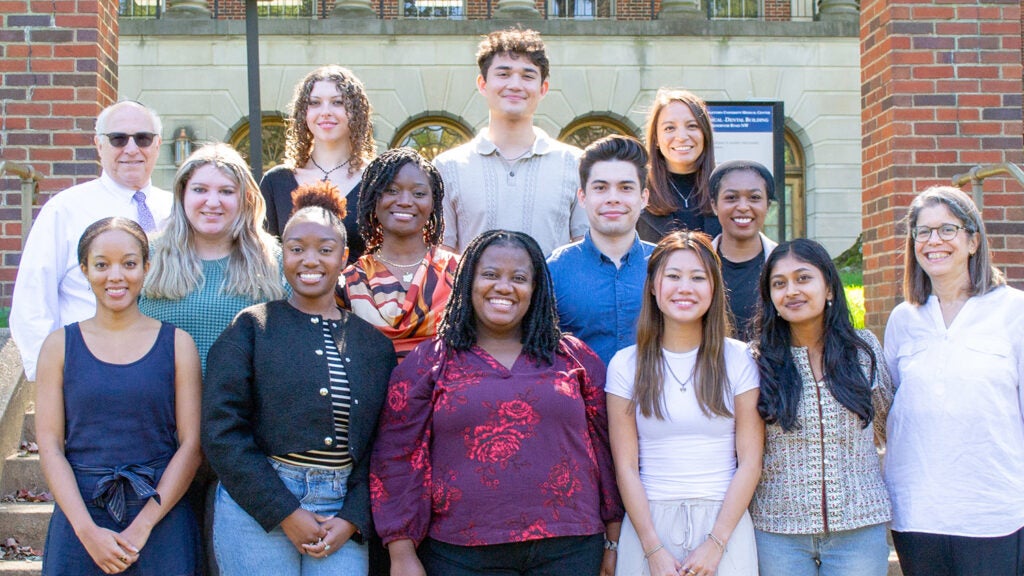 Students pose with Dr. Amri and Dr. Haramati on the Medical and Dental Building Steps.